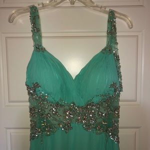 Turquoise prom dress with gems and lace